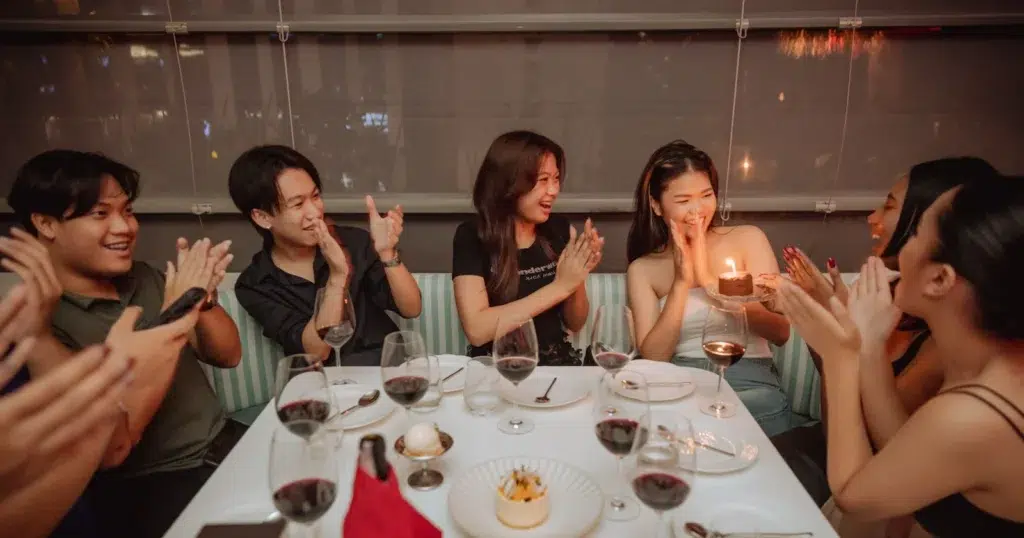 group of people celebrating a birthday at Mami Rose restaurant in Bangkok