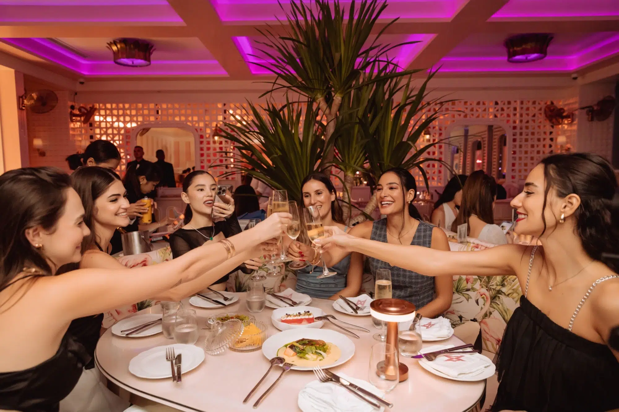 Photo of girls who eating fine dining food and toasting champagne for Mami Fridays at the Mami Rose restaurant in Bangkok's EmSphere Mall