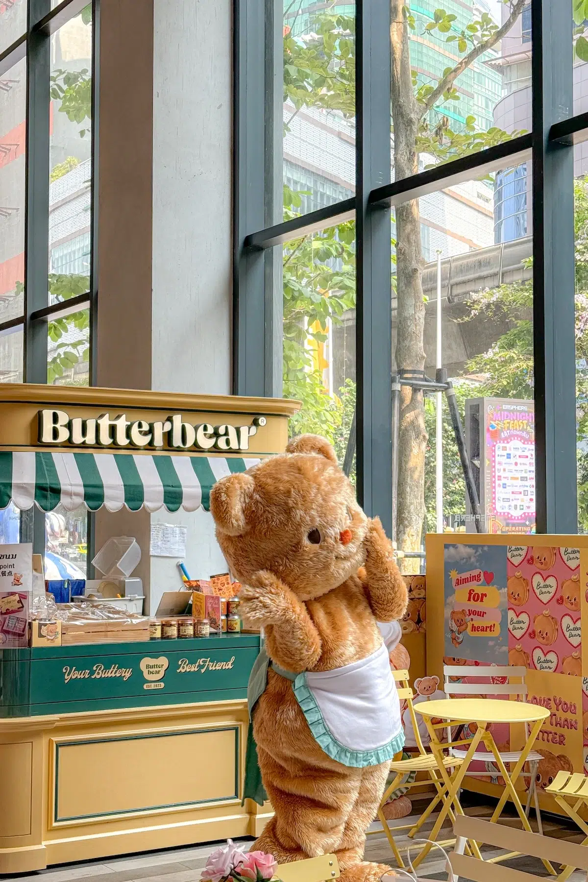 Nong Butterbear posing in fornt of the Butterbear Café at EmSphere in Bangkok