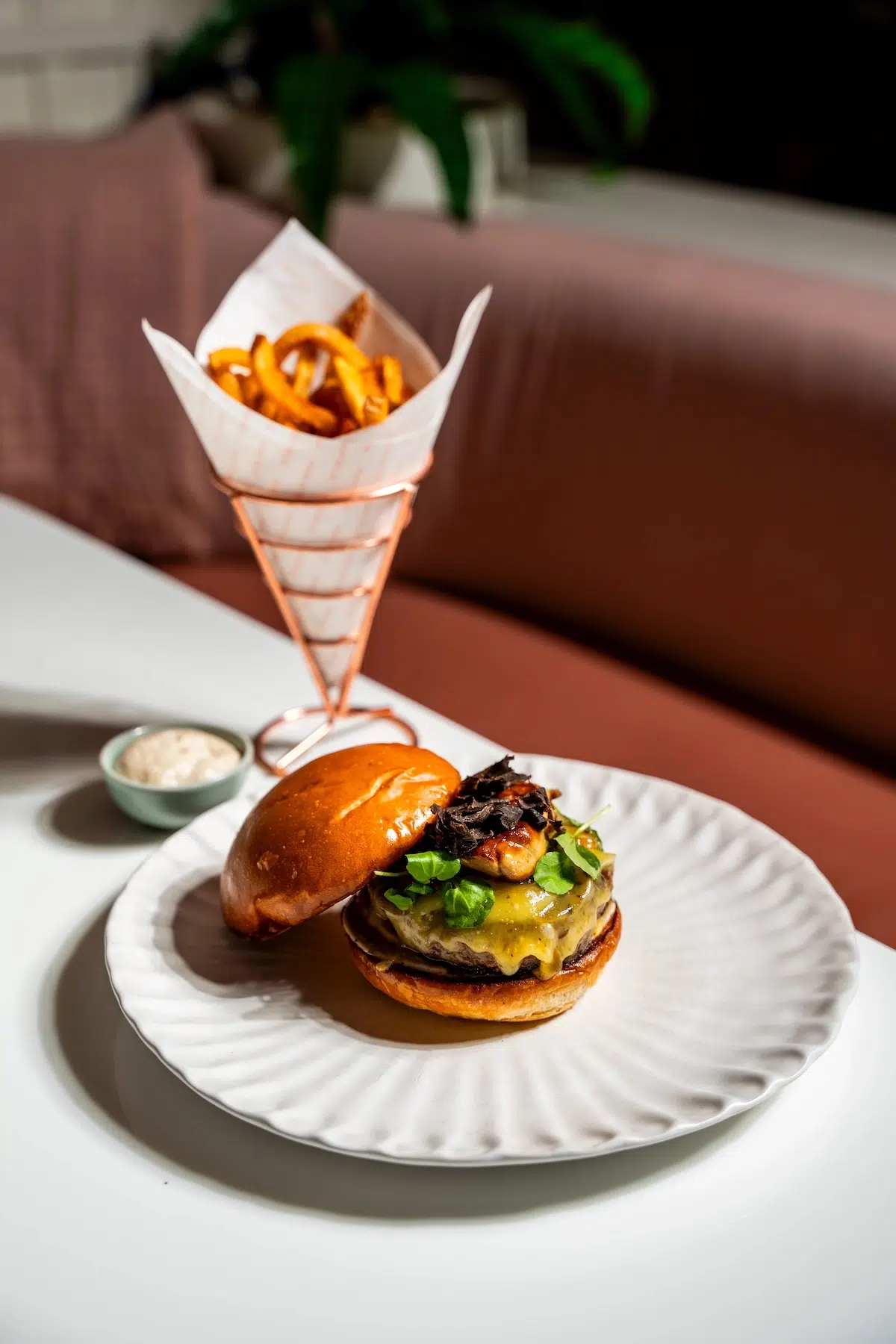 Mami Rose signature burger served with homemade fries in Bangkok Thailand