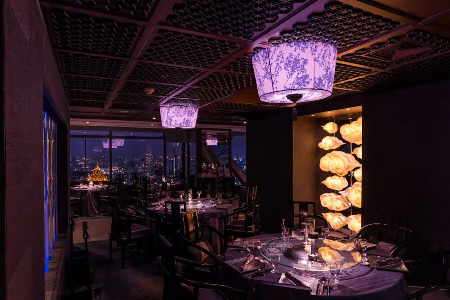 This is the interior of the romantic Chinese Bai Yun restaurant with a beautiful subdued purple light