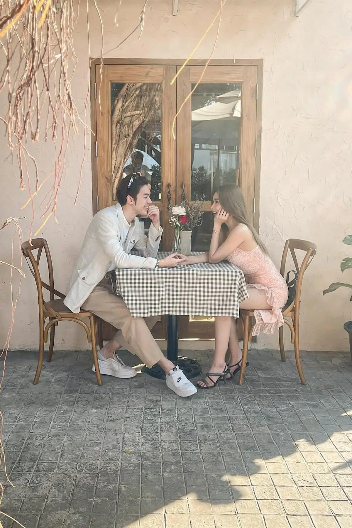 A couple is dating at LoveMeTender restaurant. A french restaurant at Bangkok