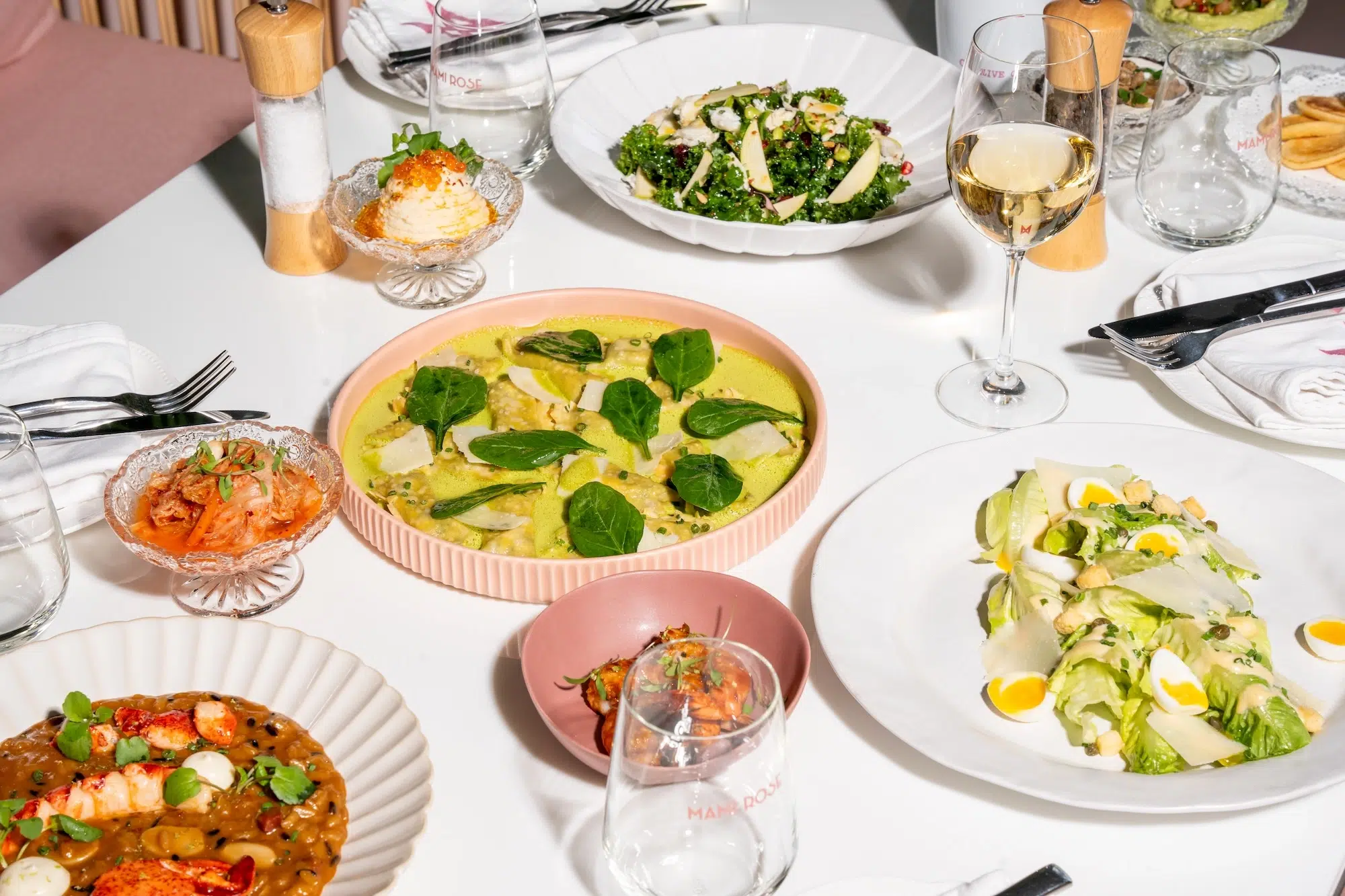 top shot of food on a table at Mami Rose from our menu of August 2024