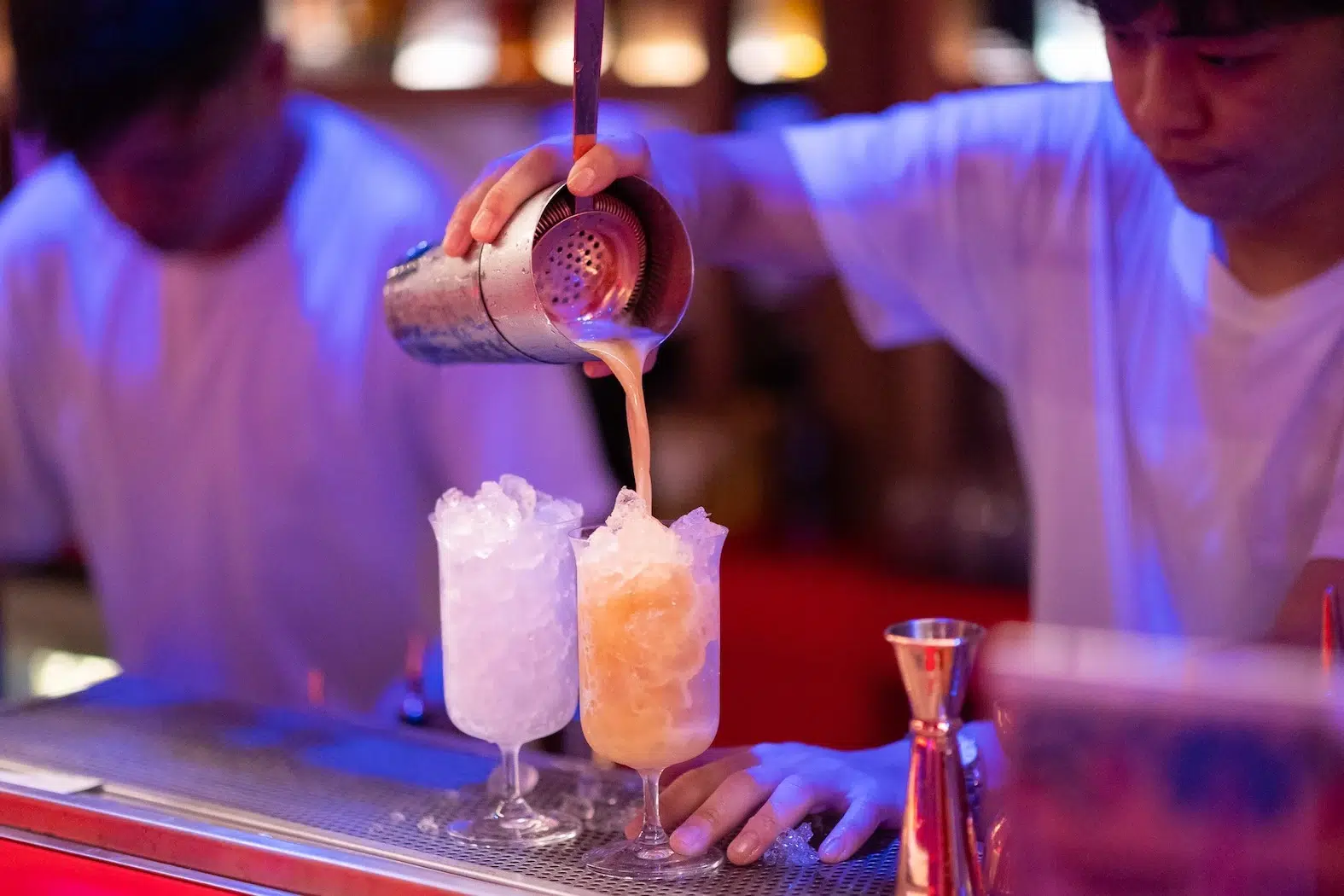 This photo shows a bartender making cockails in Tribe Sky Beach Club located at EmSphere in Bangkok.