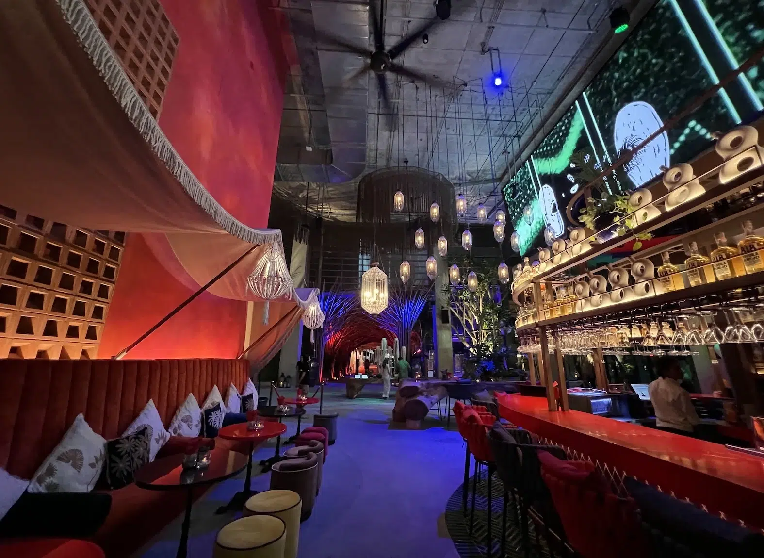This photo shows the bar from Tribe Sky Beach Club located at EmSphere in Bangkok. You can see a mexican-like decor. This place seems to have a cozy vibe atmosphere.