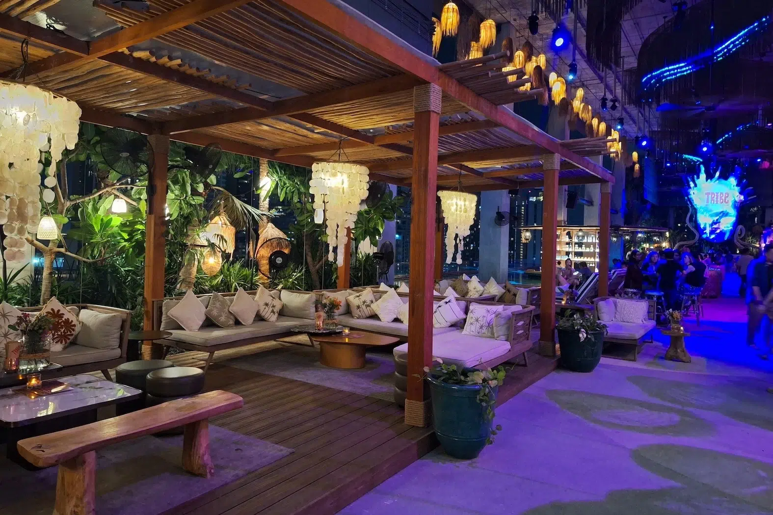This photo shows the sofas from Tribe Sky Beach Club located at EmSphere in Bangkok. You can see a mexican-like decor. This place seems to have a cozy vibe atmosphere.